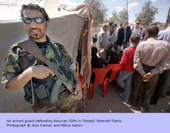 An armed guard defending Assyrian IDPs in Telsqof, Nineveh Plains.
