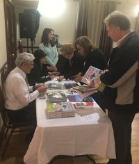 At the book signing table.