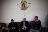 Berkho Odeesho, center, Dawudiyah’s mayor, with fellow Christian villagers. Mr. Odeesho, like many others, has plans to leave.   Credit: Adam Ferguson for The New York Times